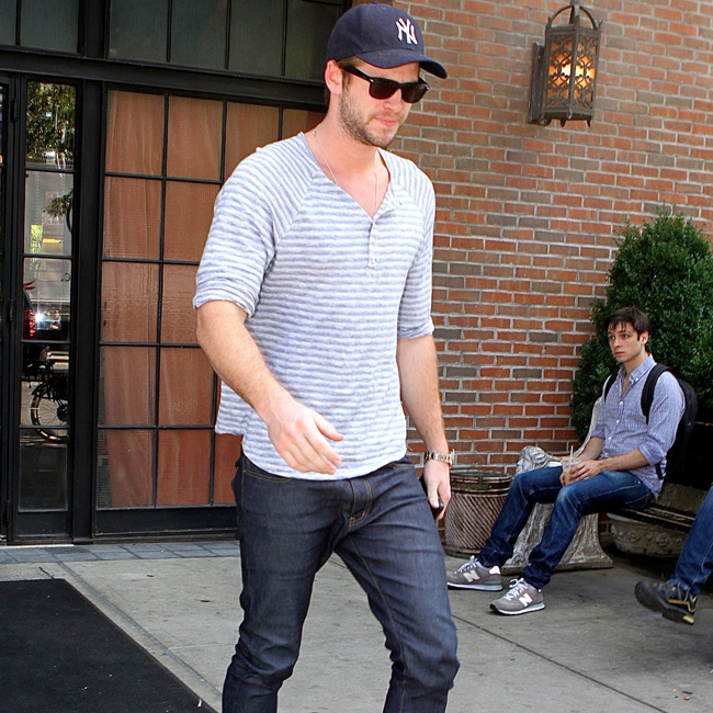 Liam Hemsworth steps out in NYC to look at his new restaurant