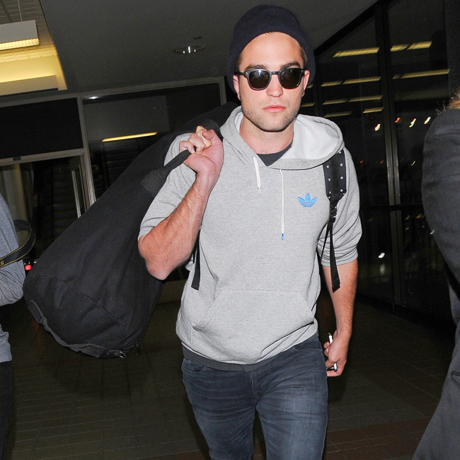 Robert Pattinson lands at LAX Airport