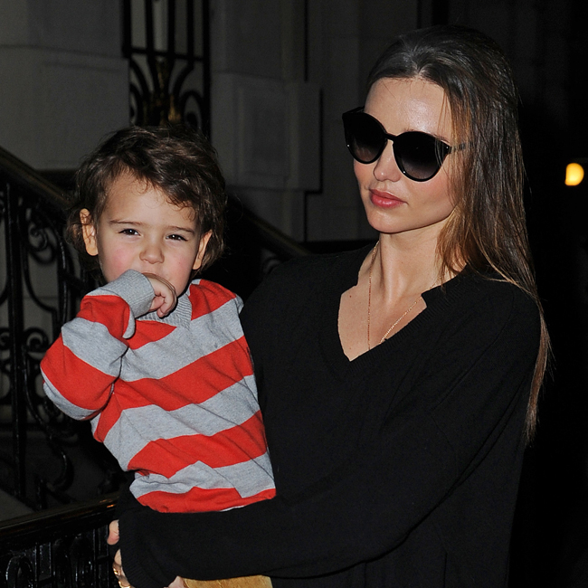Miranda Kerr carries her adorable son Flynn as they arrive back at their apartment after a day out in NYC