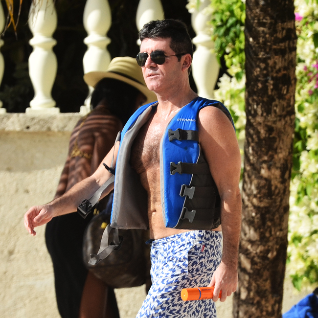 Simon Cowell is spotted on the beach in Barbados